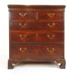 An 18th century oak chest of two short over three long drawers on bracket feet, h. 103 cm, w. 96 cm,