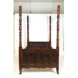 A 19th century French chestnut four poster bed with carved footboard panel and siderails, along with