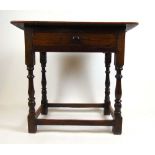 An 18th century oak single drawer side table, the moulded top on turned legs, h. 74 cm, w. 77 cm, d.