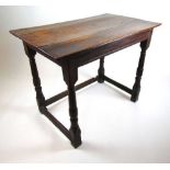 A late 17th century and later oak and elm side table, the top over turned legs joined by stretchers,