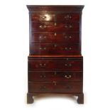 A mid 18th century mahogany chest on chest, the dental cornice over blind fret entablature, two