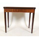 A late 18th century mahogany and rosewood banded tea table, the fold over top supported on a