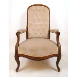 A 19th century mahogany framed nursing chair upholstered in a button back dusty pink fabric on