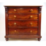 A 19th century mahogany chest of four long drawers on turned feet, h. 99 cm, w. 106 cm, d. 52