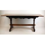 An early 18th century and later oak dining table, the three plank cleated top on shaped slab end