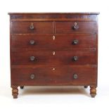 A late 18th century mahogany and boxwood strung chest of two short over three long drawers on turned