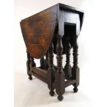 An early 18th century and later oak gateleg table, the later oval top supported on two single gate