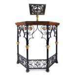 A 19th century wrought iron, oak and brass lectern, the brass book rest on the oak rail over the