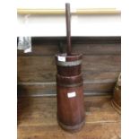 A reproduction pine butter churn