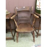 A 19th century elm and beech open arm chair