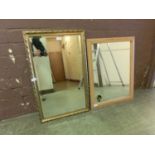 A gilt framed bevel glass mirror along with a pine framed mirror