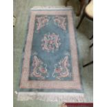 A Chinese blue ground rug with dragon designCondition report: Dimensions as follows: L: 154cm or