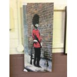 A stretched canvas after Banksy