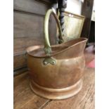 A brass and copper coal bucket