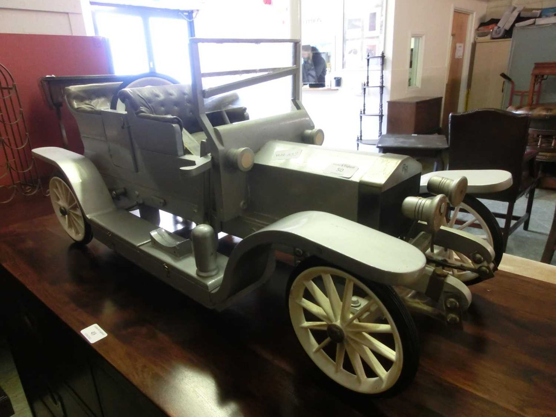 A hand made model of a silver Rolls Royce