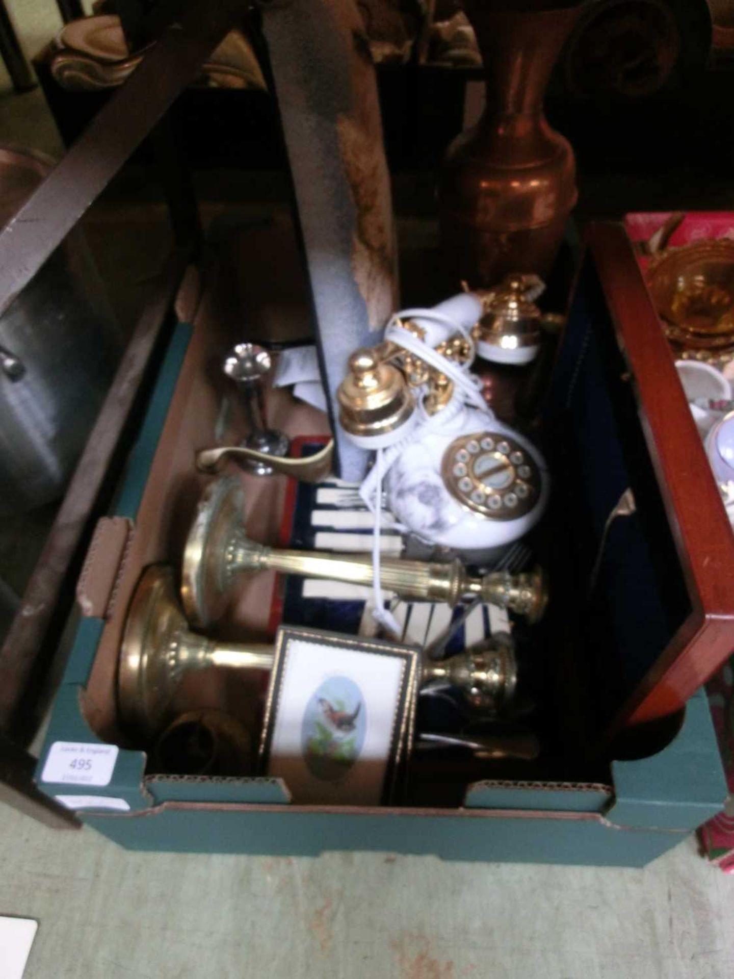 A tray containing a telephone, candlesticks, copper ewer, etc