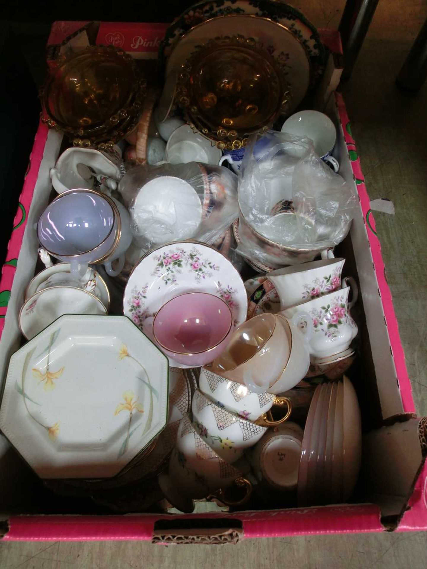 A tray of decorative ceramic and glassware