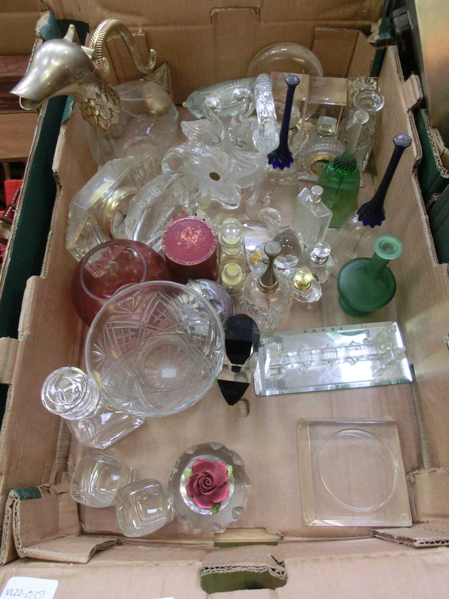 A tray containing assorted glassware to include paperweights, claret jug, etc