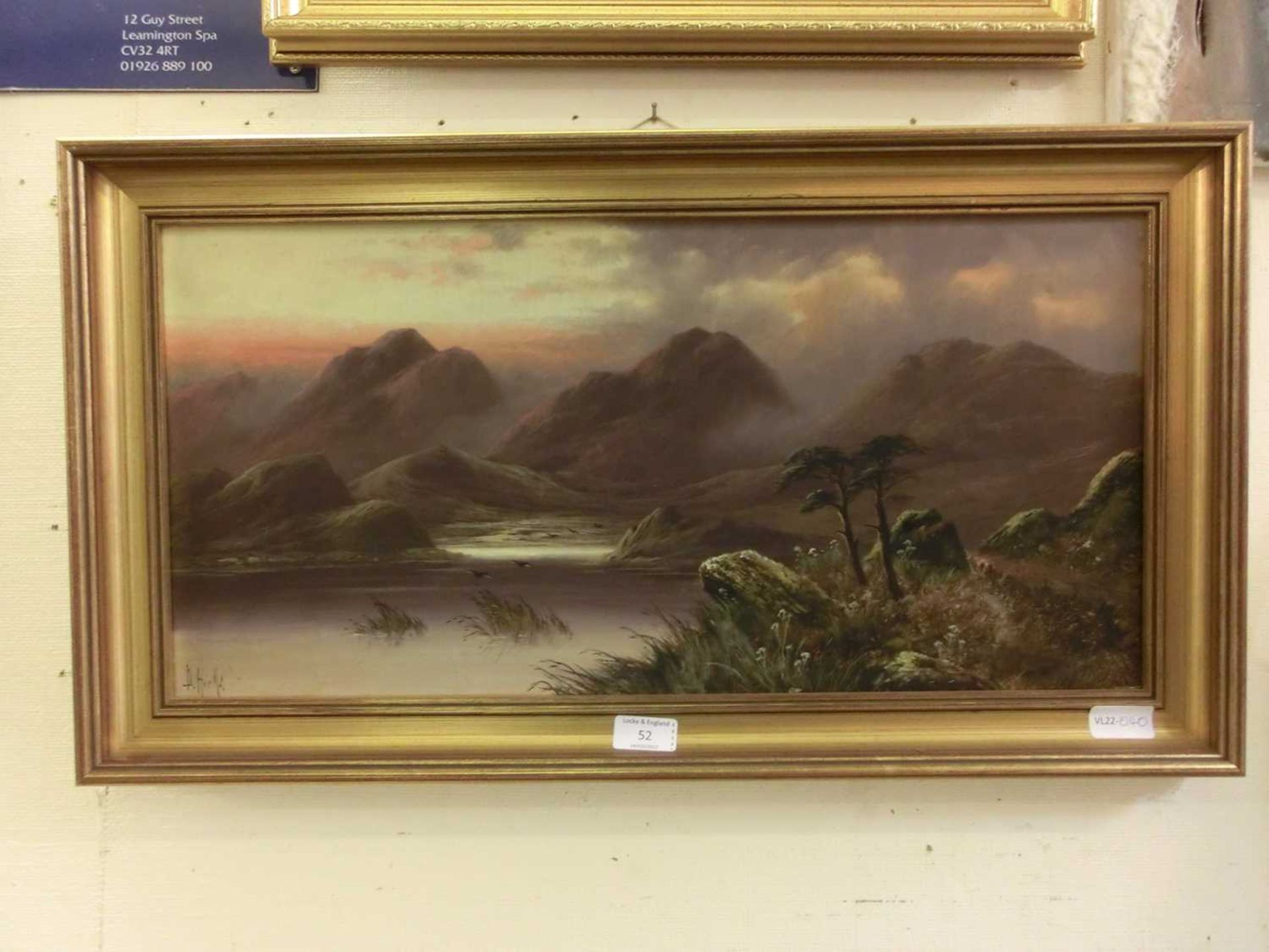 A gilt framed oil on canvas of mountainous lake scene signed Hicks