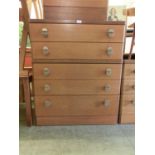 A mid-20th century teak five drawer chest