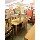 A modern oak effect rectangular dining table together with a set of six matching chairs