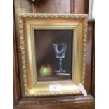 A gilt framed oil on board of a still life titled 'Engraved Glass With Apple' signed Jay Ward