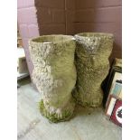 A pair of weathered planters in the form of owls
