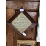 A rosewood framed sampler of The Lords Prayer dated 1844