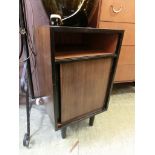 A mid-20th century black painted bedside cabinet