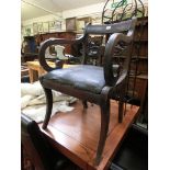 A Georgian mahogany open arm chair
