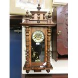 An early 20th century walnut cased drop-dial wall clock