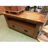 A modern oak TV stand with drawer to base