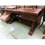 An Indonesian hardwood two drawer desk