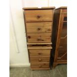 A pair of modern pine three drawer bedside chests