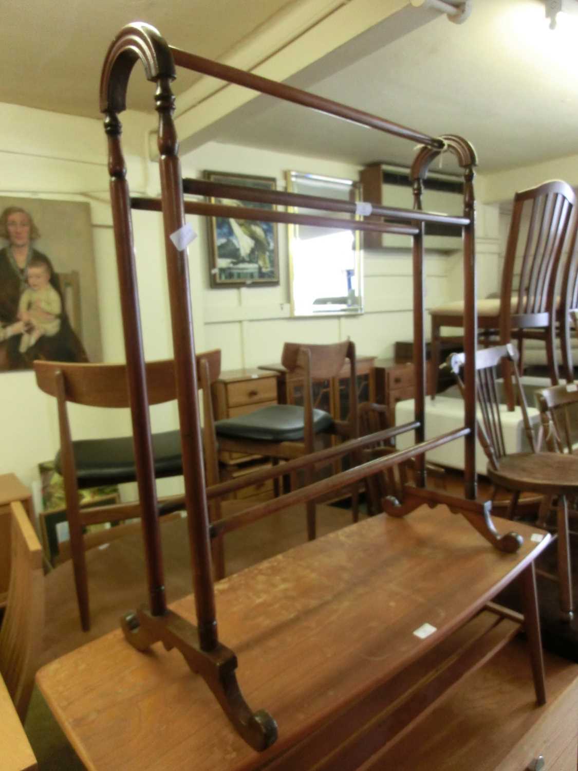 An early 20th century mahogany towel rail