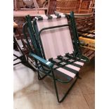 Two green metal framed striped fabric folding chairs