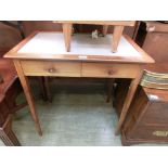 An early 20th century mahogany side table having a leatherette insert to top with two small drawers