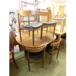 A mid-20th century design G-Plan drop leaf table together with a set of four matching chairs with