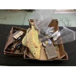 A carton containing an assortment of items to include planes, wooden fish, measuring tape, scales,