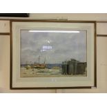 A framed and glazed watercolour of a coastal boating scene signed bottom right