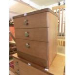 A mid-20th century teak three drawer chest