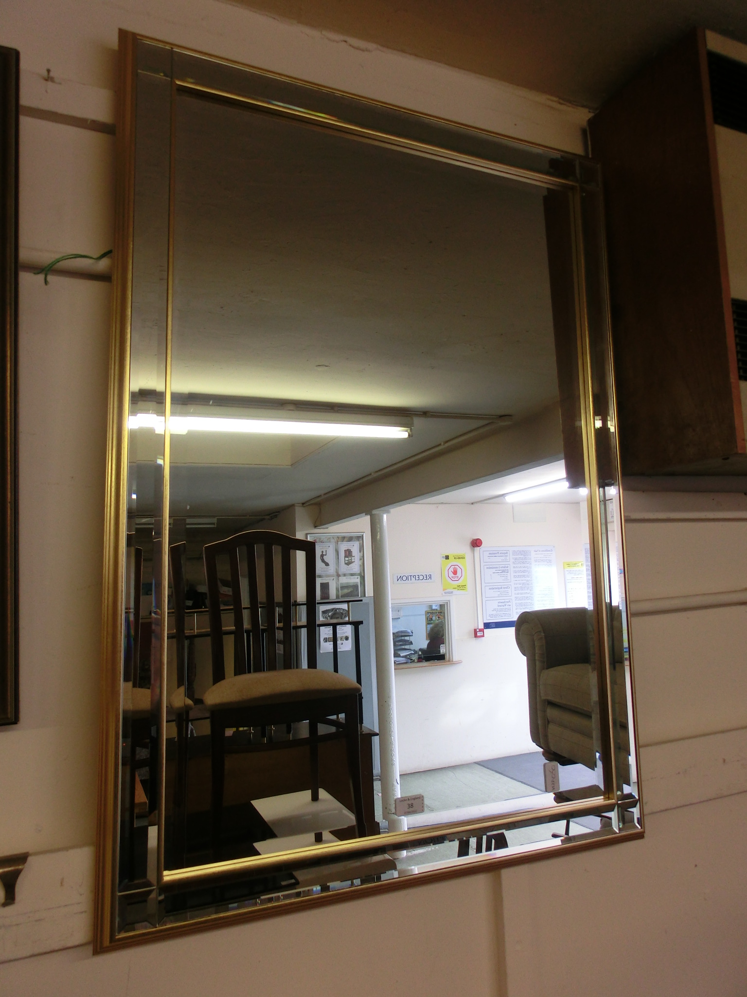 A modern rectangular bevel glass mirror