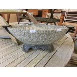 A cast metal garden planter