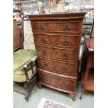 A reproduction yew box fronted chest of five graduated drawers