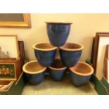 A set of six blue glazed garden pots