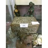 A selection of brass and other oriental items to include sitting Buddha, seated lady, embossed