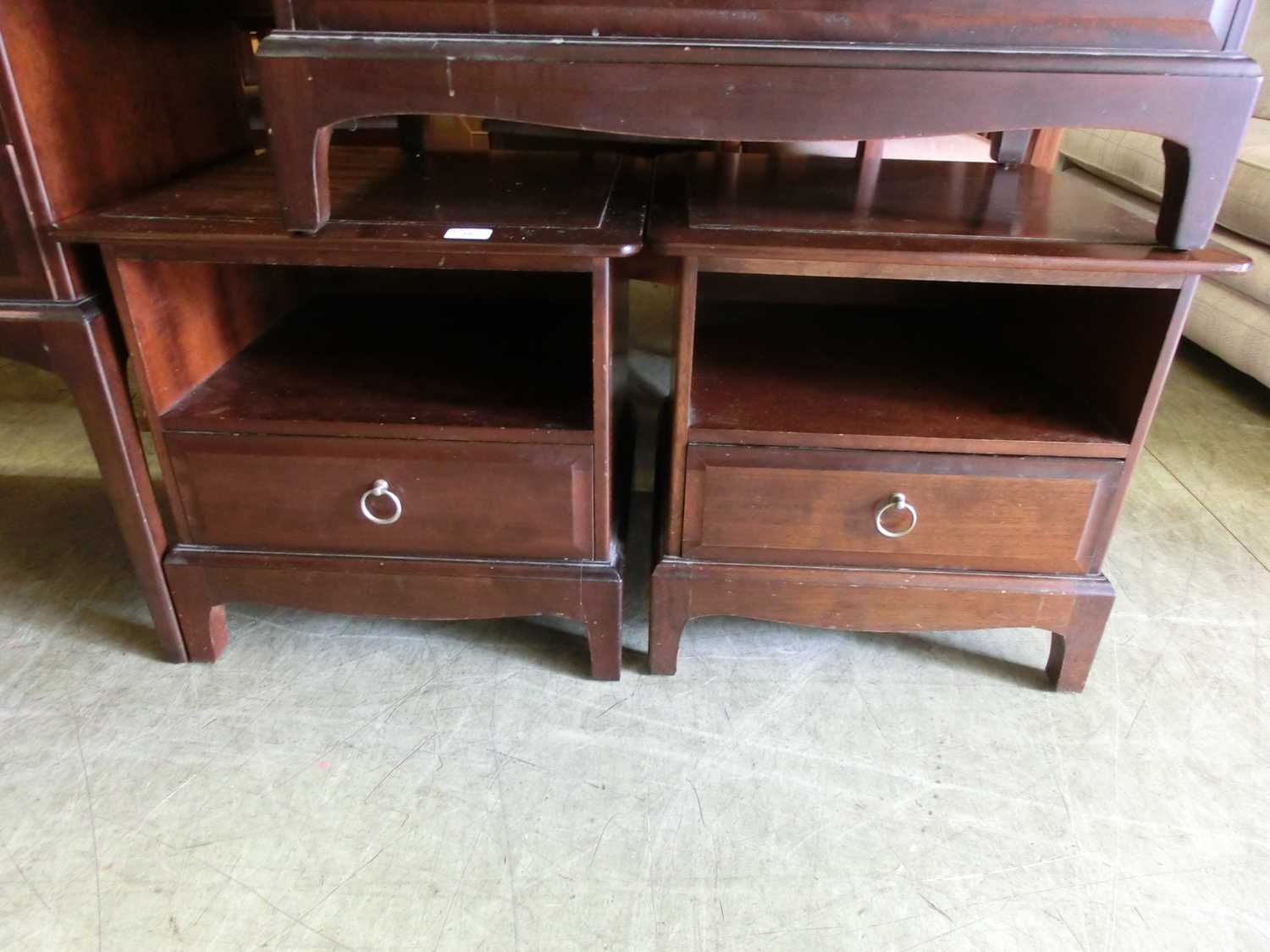 A pair of Stag Minstrel bedside cabinets having open storage above single drawer