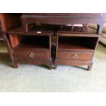 A pair of Stag Minstrel bedside cabinets having open storage above single drawer