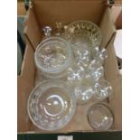 A tray containing glassware to include bowls, etc