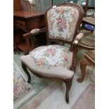 An open arm needlework upholstered chair